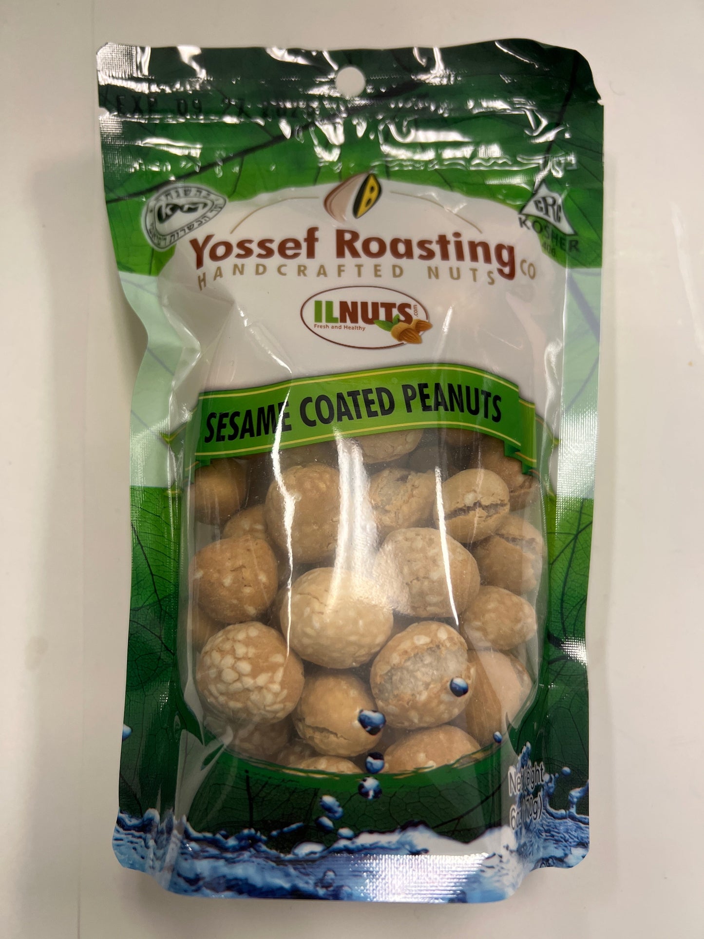Yossef roasting sesame coated peanuts