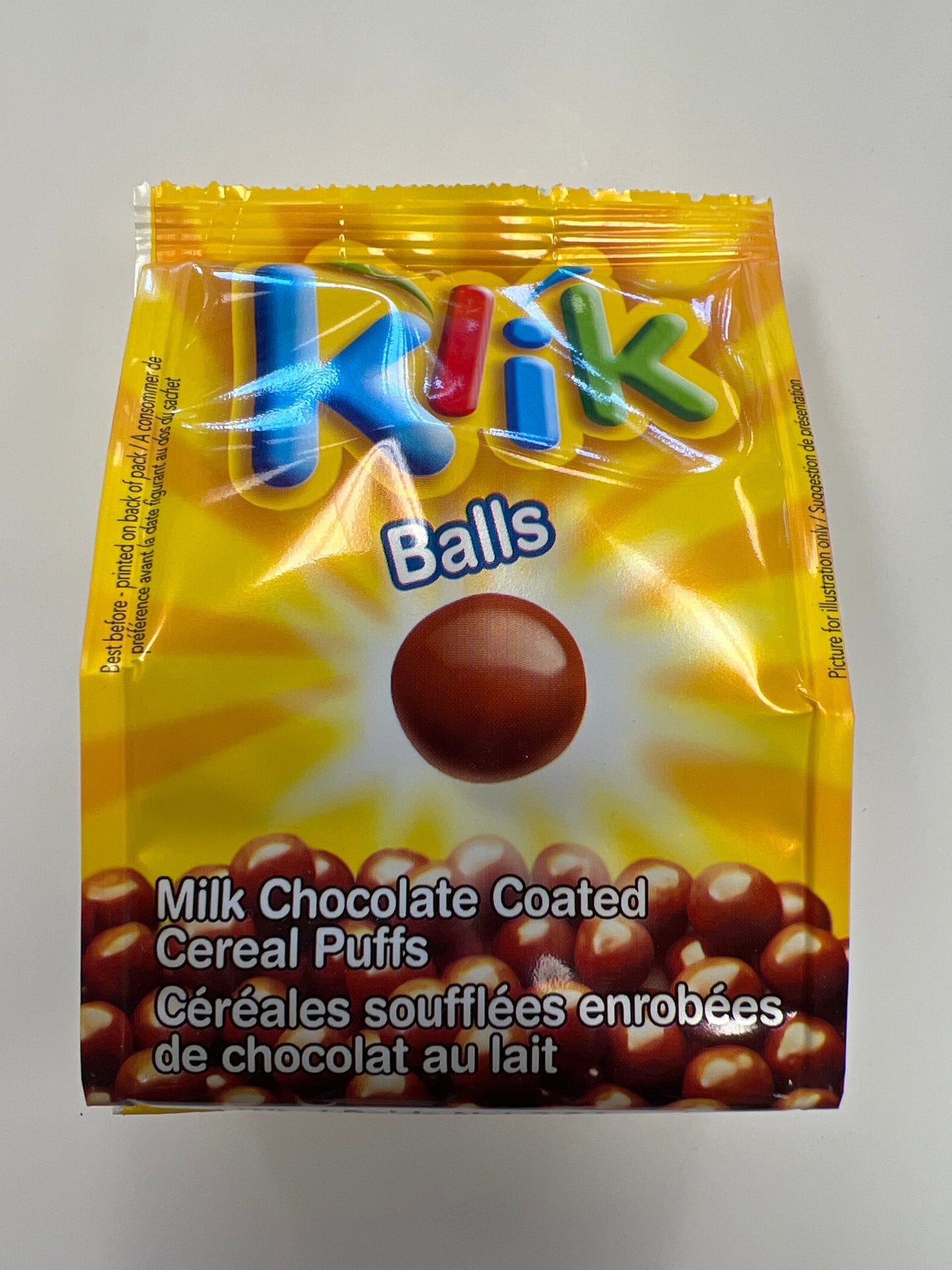 Klik balls. Milk chocolate coated cereal puffs￼
